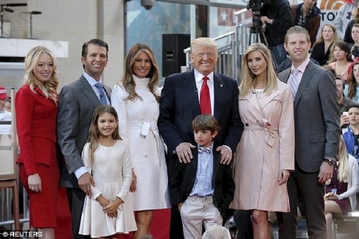 Donald Trump with all his children and wife Melania Trump posing for a "happy" family picture.