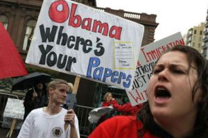 Protesters who claim Obama wasn't born in United States.