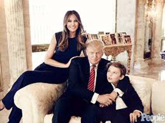 Barron Trump with Donald Trump and Melania Trump.