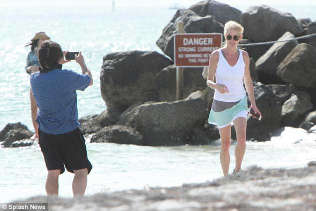 Kellyanne Conway with her husband George T Conway in beach side Florida. George is taking her pictures.