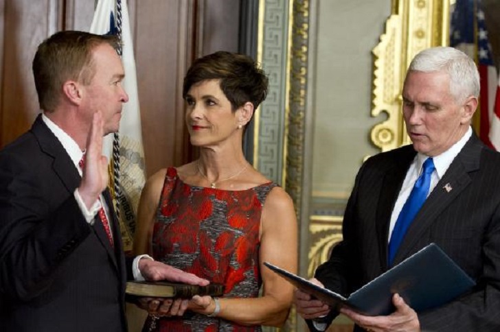 Vice President Mike Pence and Mick Mulvaney along with his wife while he takes the swear for OMB Director.