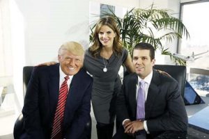 Natalie Morales with Donald Trump and his eldest son Donald Trump Jr.
