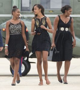 First lady Michelle Obama, right, and her daughters Sasha, left, and Malia.