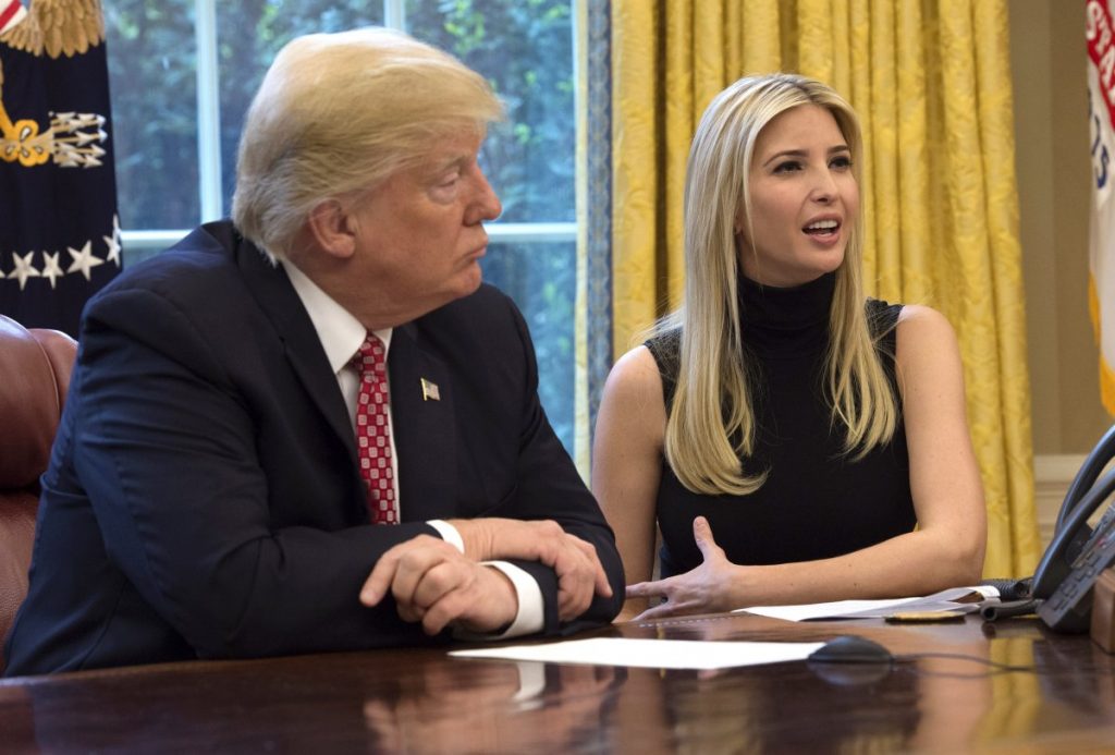 U.S. President Donald Trump listens while his daughter Ivanka speaks during a video conference with NASA astronauts 