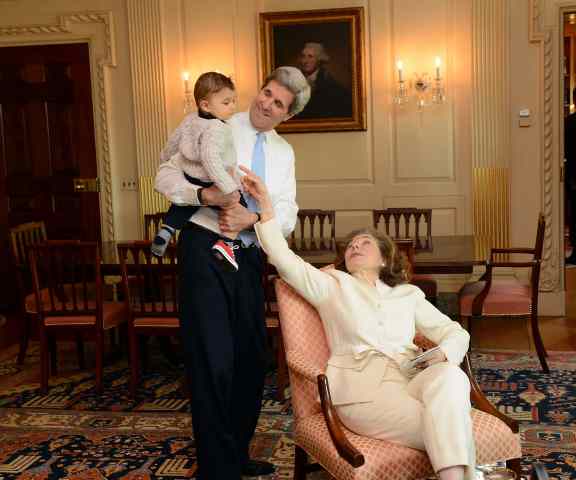 John Kerry and his wife with their grandson.